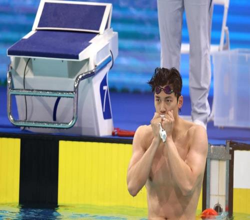 鏡頭內(nèi)外｜ “過山車” 式奪冠與泳池老兵的堅守